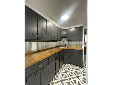 Step into a beautifully renovated 728 sq ft office building that - photo 9