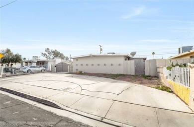 This single-story home offers three bedrooms and two full