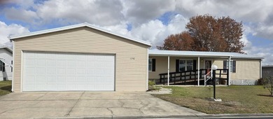 This beautiful 4-bedroom, 2-bath lakefront home sits on a - photo 1