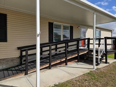 This beautiful 4-bedroom, 2-bath lakefront home sits on a - photo 2