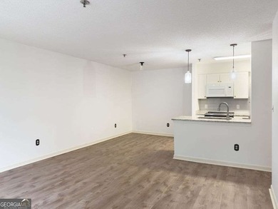 Welcome to this beautiful 3rd-floor condo in the prestigious 55+