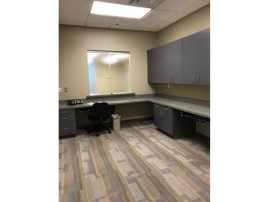 The first floor has a vestibule entrance with a stairwell and