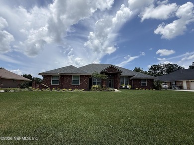 Set in a quiet, established neighborhood, this all-brick 4BR/3BA - photo 1