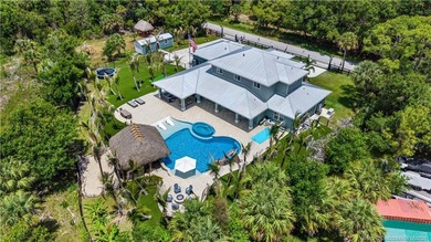 Behind a private electronic gate in prestigious Palm City Farms - photo 3
