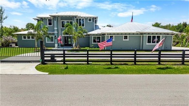 Behind a private electronic gate in prestigious Palm City Farms - photo 4