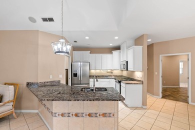 Designed with an attractive open-concept floor plan, the - photo 9
