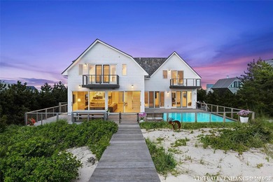 Set along coveted Dune Road, this jetty-protected oceanfront - photo 3