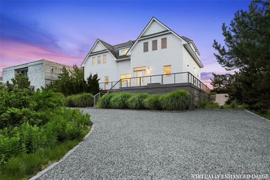 Set along coveted Dune Road, this jetty-protected oceanfront - photo 5