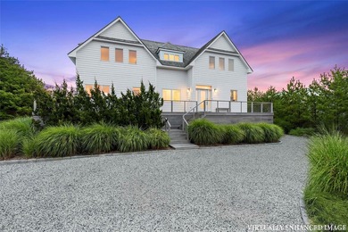 Set along coveted Dune Road, this jetty-protected oceanfront - photo 6