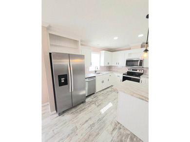 This Beautiful MOVE IN READY 2022 Jacobsen 2 Bed 2 Bath Home is - photo 5