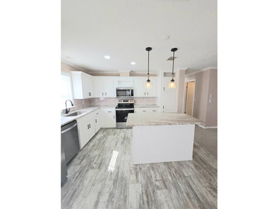 This Beautiful MOVE IN READY 2022 Jacobsen 2 Bed 2 Bath Home is - photo 6
