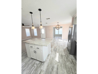 This Beautiful MOVE IN READY 2022 Jacobsen 2 Bed 2 Bath Home is - photo 8