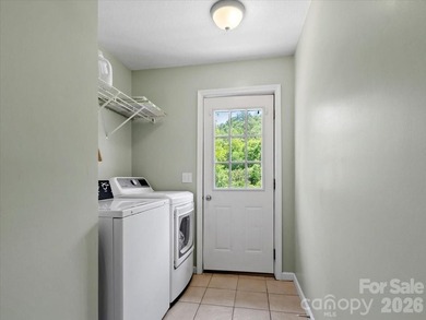 Escape to this warm and inviting 1.5-story mountain home set on - photo 11