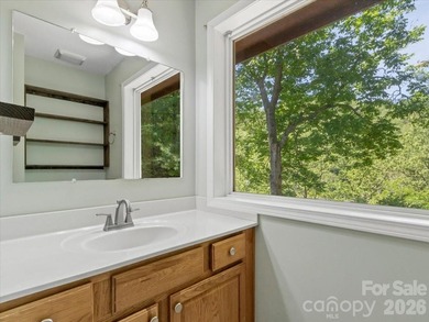 Escape to this warm and inviting 1.5-story mountain home set on - photo 13