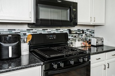 Four bedrooms, two baths, and 1,473 square feet with an open - photo 14