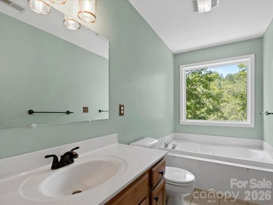 Escape to this warm and inviting 1.5-story mountain home set on - photo 22