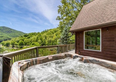Escape to this warm and inviting 1.5-story mountain home set on - photo 37
