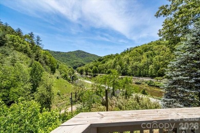 Escape to this warm and inviting 1.5-story mountain home set on - photo 39