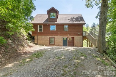 Escape to this warm and inviting 1.5-story mountain home set on - photo 40