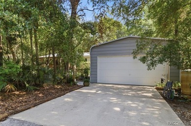 Framed by a canopy of mature trees and lush landscaping, this - photo 2