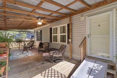 Framed by a canopy of mature trees and lush landscaping, this - photo 7