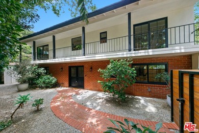 Nestled on a rare private flat lot along Sicomoro Drive in the - photo 1