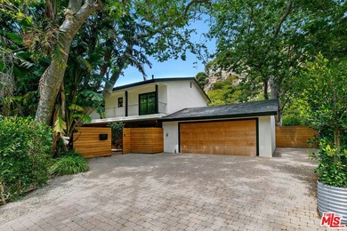 Nestled on a rare private flat lot along Sicomoro Drive in the - photo 2