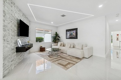 A striking, newly renovated two-story residence showcasing - photo 11