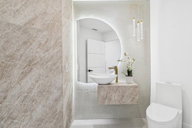 A striking, newly renovated two-story residence showcasing - photo 12