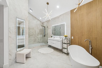 A striking, newly renovated two-story residence showcasing - photo 14