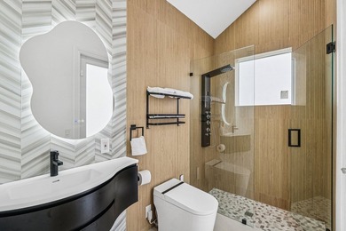 A striking, newly renovated two-story residence showcasing - photo 15