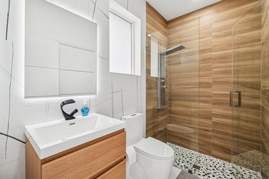 A striking, newly renovated two-story residence showcasing - photo 17