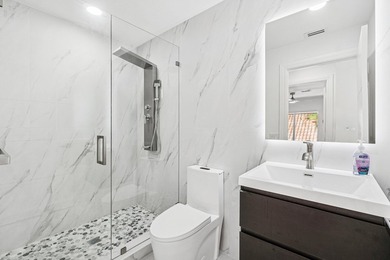 A striking, newly renovated two-story residence showcasing - photo 23