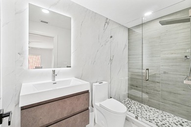 A striking, newly renovated two-story residence showcasing - photo 25