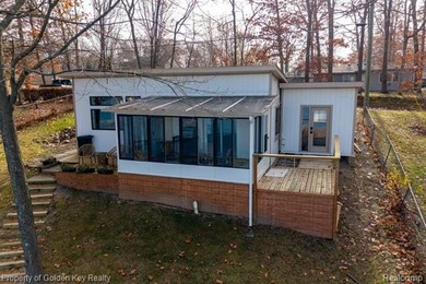 Handy Lake Home For Sale in Hartland Michigan