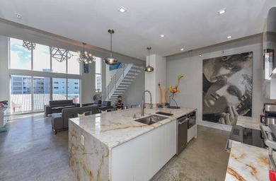 The main level offers a newer custom kitchen with marble - photo 11