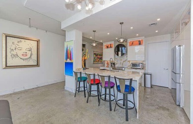 The main level offers a newer custom kitchen with marble - photo 12