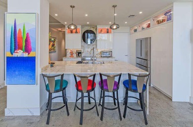 The main level offers a newer custom kitchen with marble - photo 13