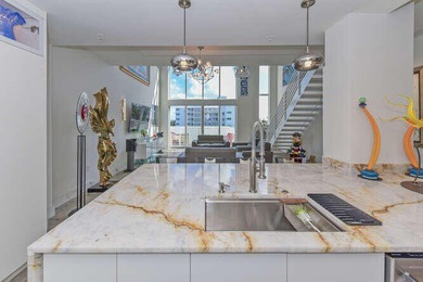 The main level offers a newer custom kitchen with marble - photo 15