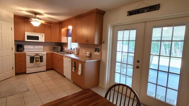 This marvelous custom-built CBS pristine, furnished home on .27 - photo 16