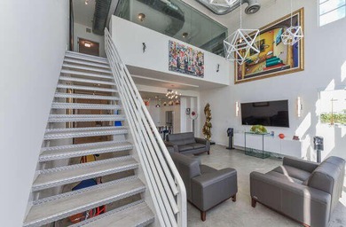 The main level offers a newer custom kitchen with marble - photo 23