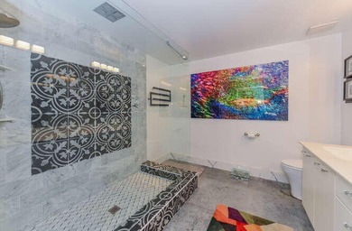 The main level offers a newer custom kitchen with marble - photo 33