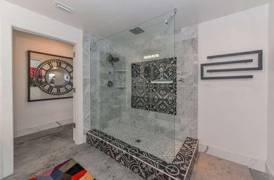 The main level offers a newer custom kitchen with marble - photo 35