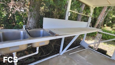 This marvelous custom-built CBS pristine, furnished home on .27 - photo 37