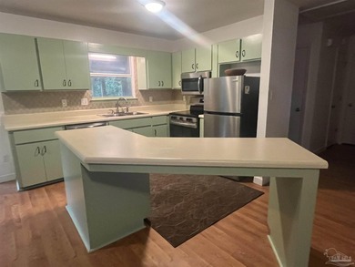 Located in the Northwest Pensacola neighborhood, this home is - photo 3