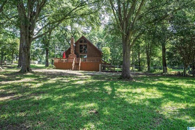 Escape to lake living with this charming waterfront home on - photo 1