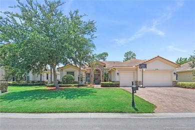 Nestled in The Falls of Jensen Beach, this spacious Kolter-built - photo 3
