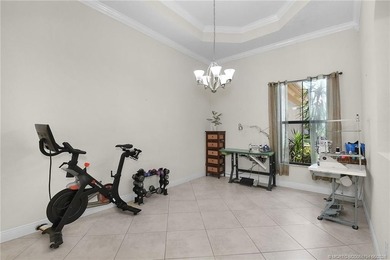 Nestled in The Falls of Jensen Beach, this spacious Kolter-built - photo 8