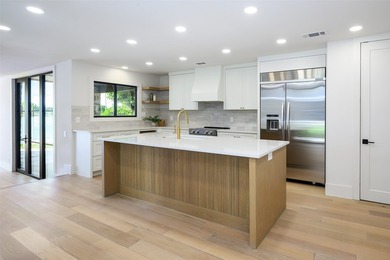 Experience elevated waterfront living at 313 Scenic Drive, where - photo 12