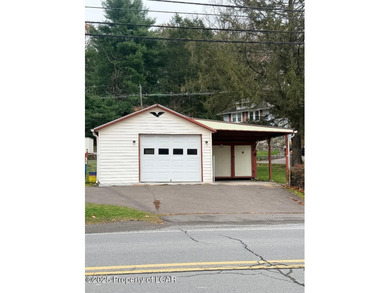 Very well maintained Cape Cod with garage and car port. Large